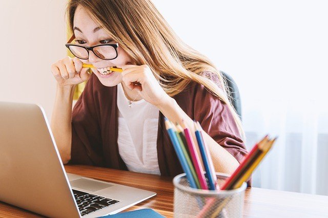 Student girl with pencil and laptop